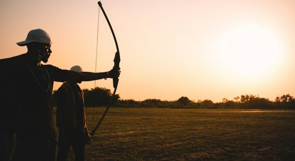 Archer with a bow representing Sagittarius personality traits in astrology